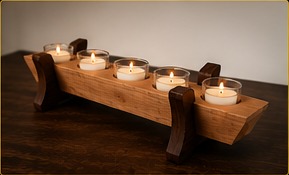 Angled view of cherry and walnut candle holder